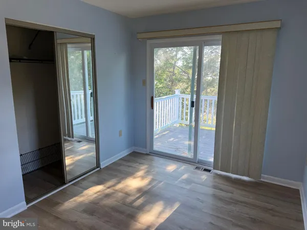 a view of entryway with wooden floor