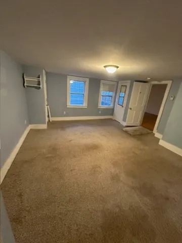 a view of a big room with windows