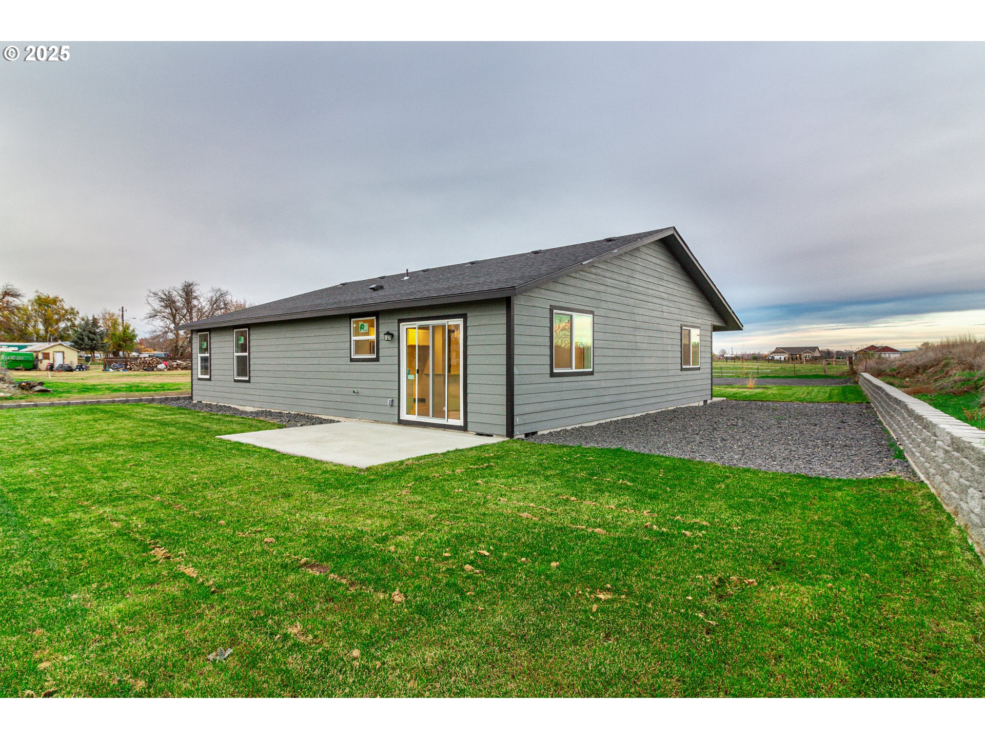 435 Northeast Sloan Street Stanfield, OR 97875 - Photo 13 of 24 a front view of a house with a yard