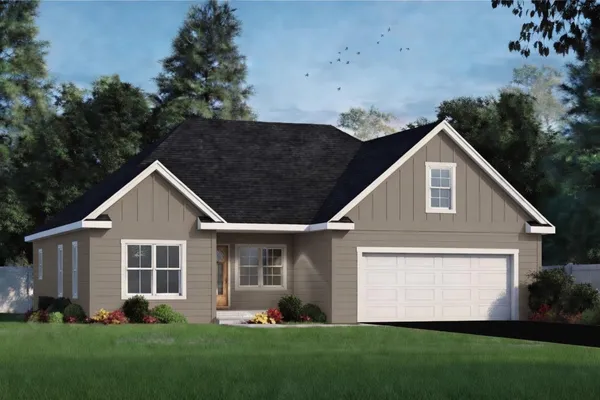 a front view of a house with a yard and garage