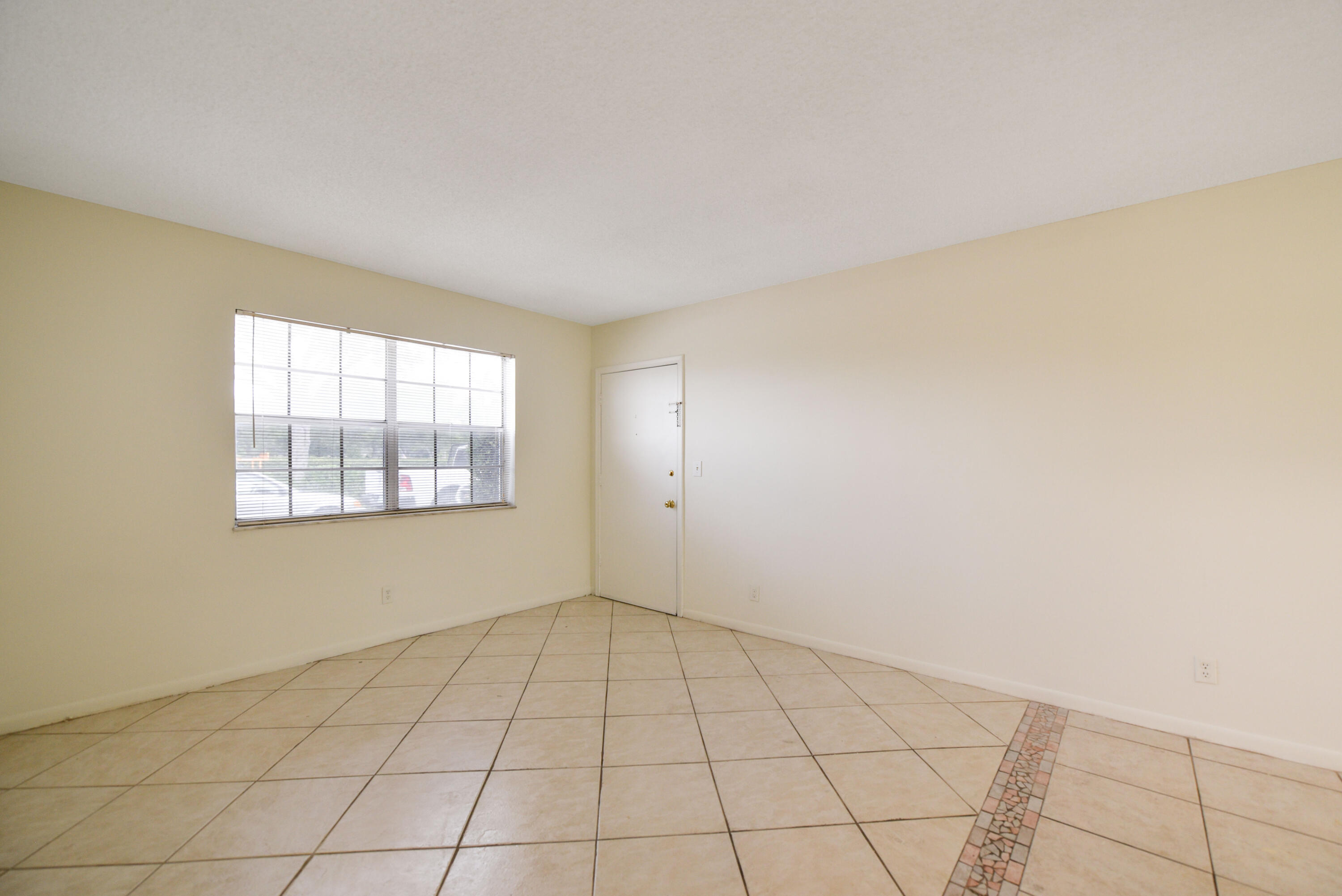 298 Southwest 6th Street, Unit 110 Boca Raton, FL 33432 - Photo 14 of 27 a view of an empty room and window