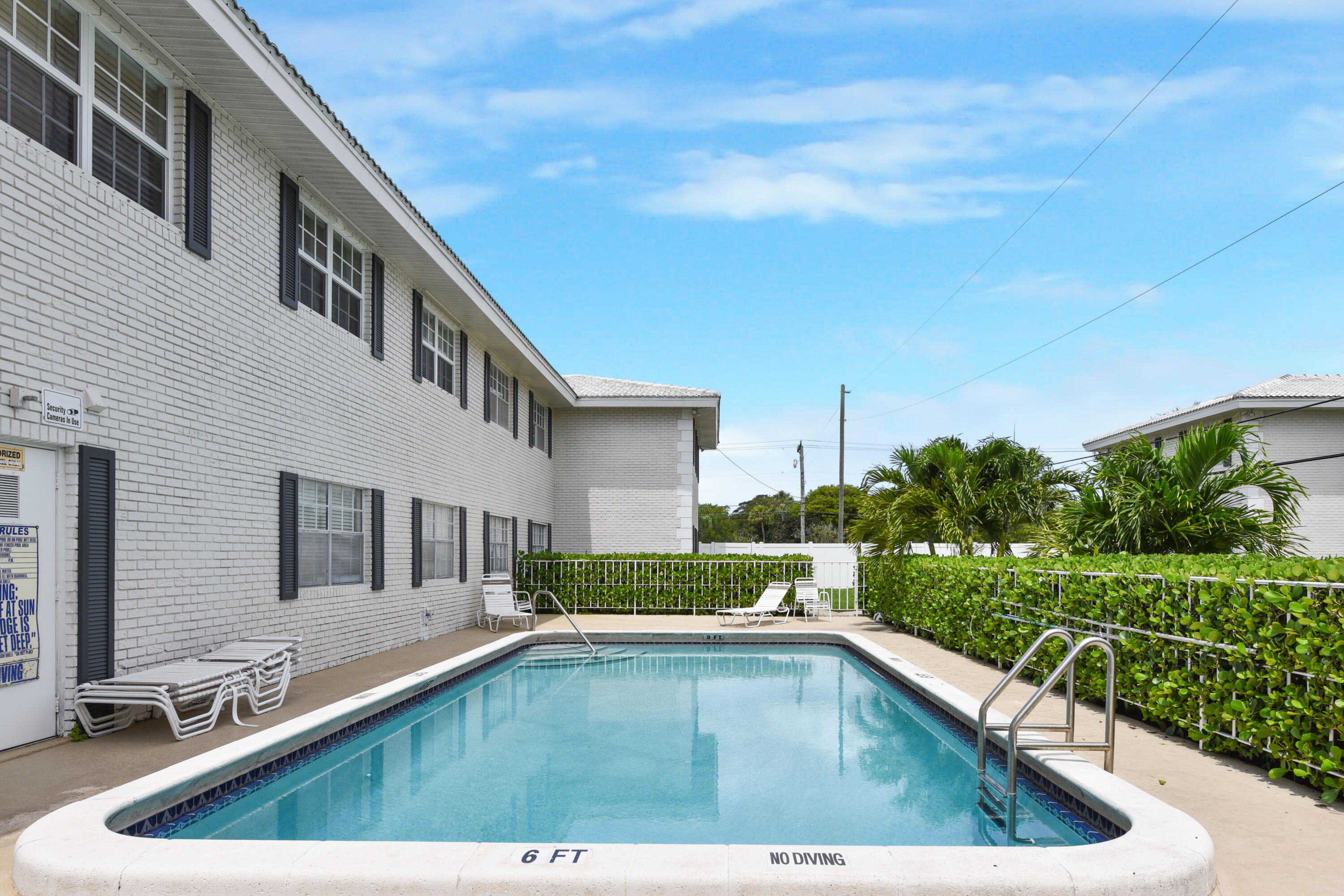 298 Southwest 6th Street, Unit 110 Boca Raton, FL 33432 - Photo 23 of 27 a view of swimming pool from a balcony