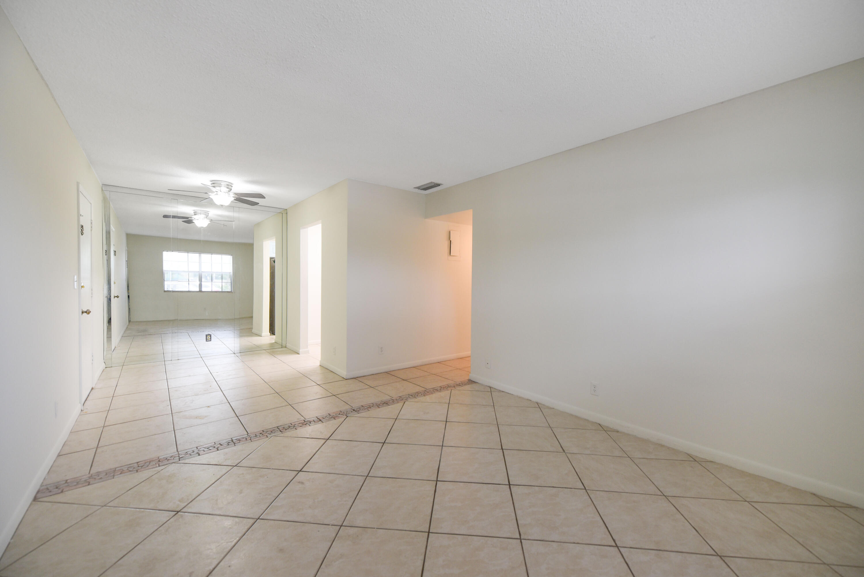 298 Southwest 6th Street, Unit 110 Boca Raton, FL 33432 - Photo 8 of 27 a view of an empty room and window