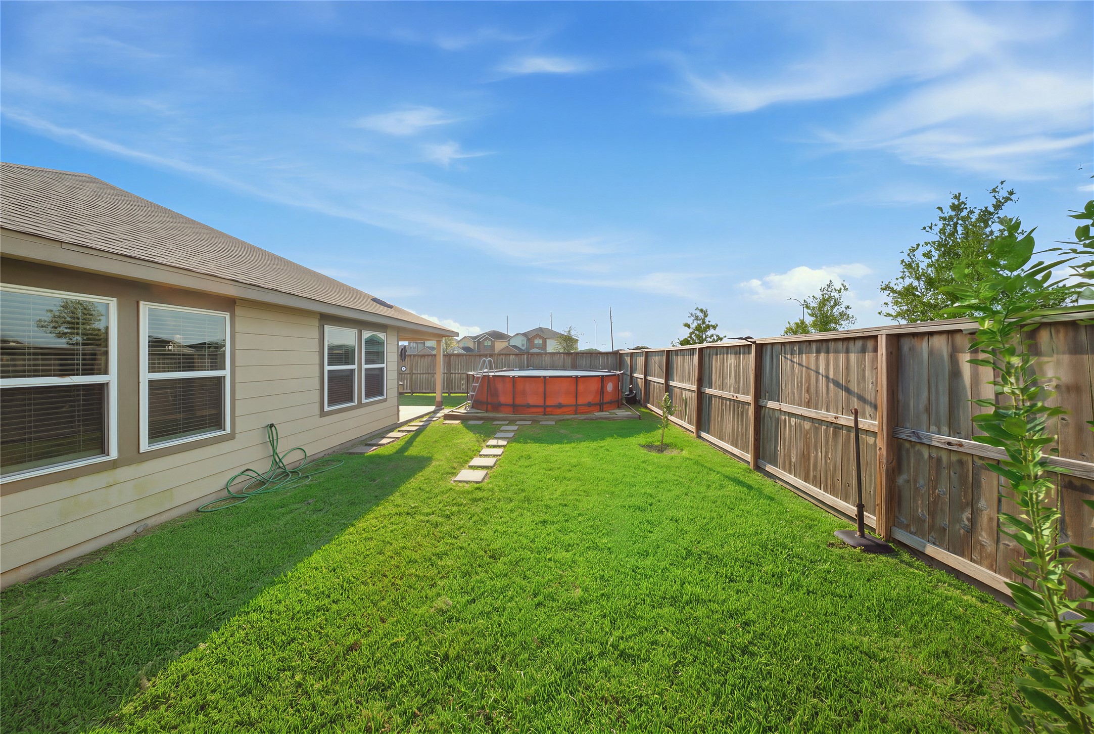 815 Barstow Drive Rosharon, TX 77583 - Photo 23 of 23 Expansive fenced backyard with above-ground pool and no rear neighbors.