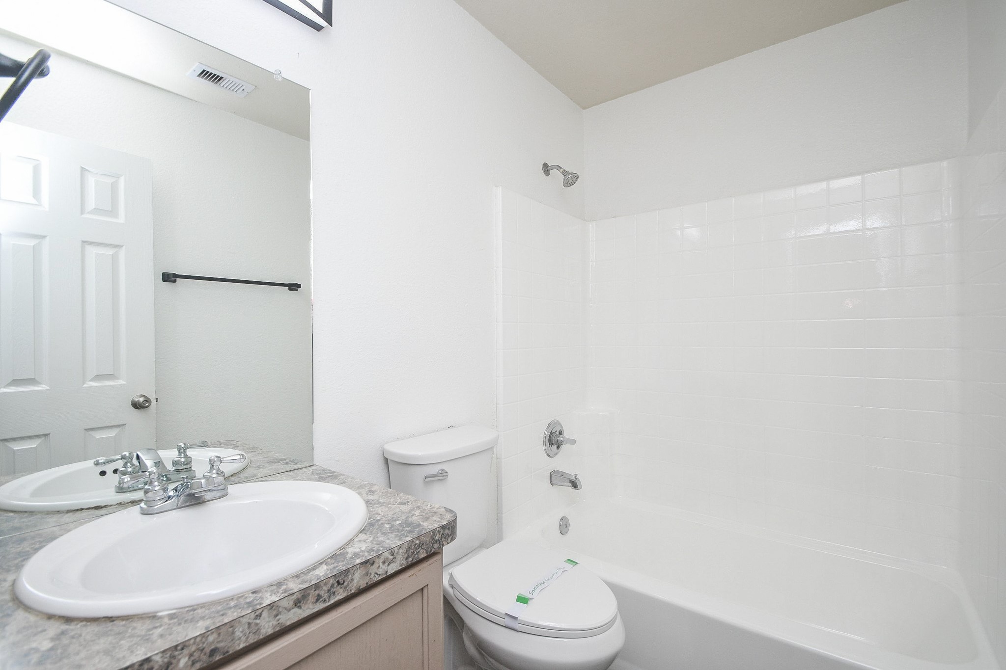 11915 Rhema Lane Houston, TX 77048 - Photo 18 of 20 a bathroom with a granite countertop sink toilet and shower