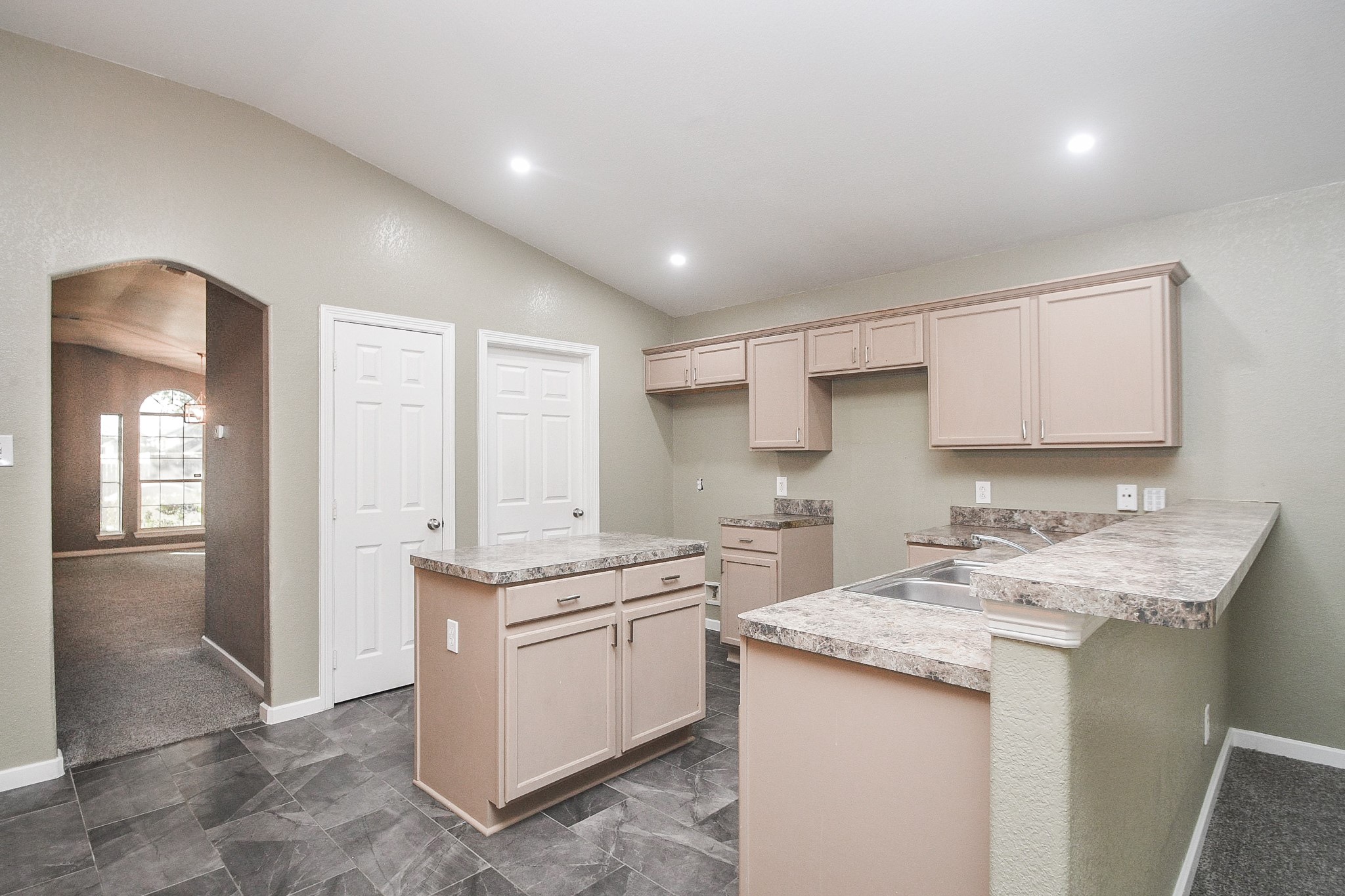 11915 Rhema Lane Houston, TX 77048 - Photo 5 of 20 a kitchen with a sink stove and cabinets