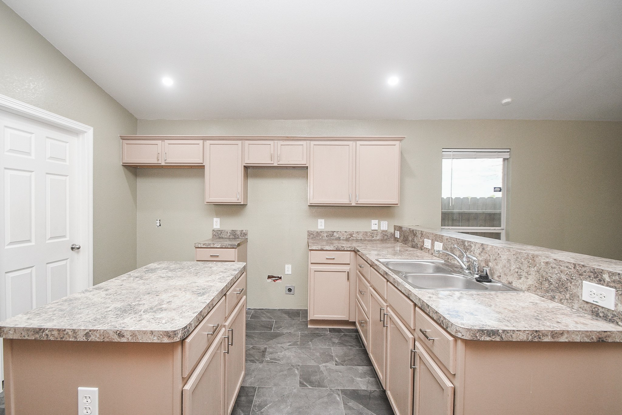 11915 Rhema Lane Houston, TX 77048 - Photo 6 of 20 a kitchen with a sink stove and cabinets