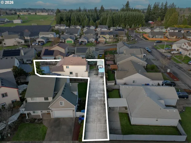 an aerial view of houses with outdoor space