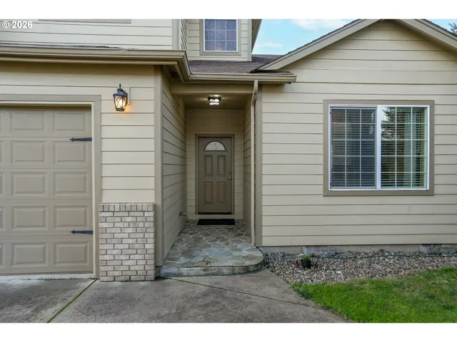 a view of a livingroom with furniture and a flat screen tv