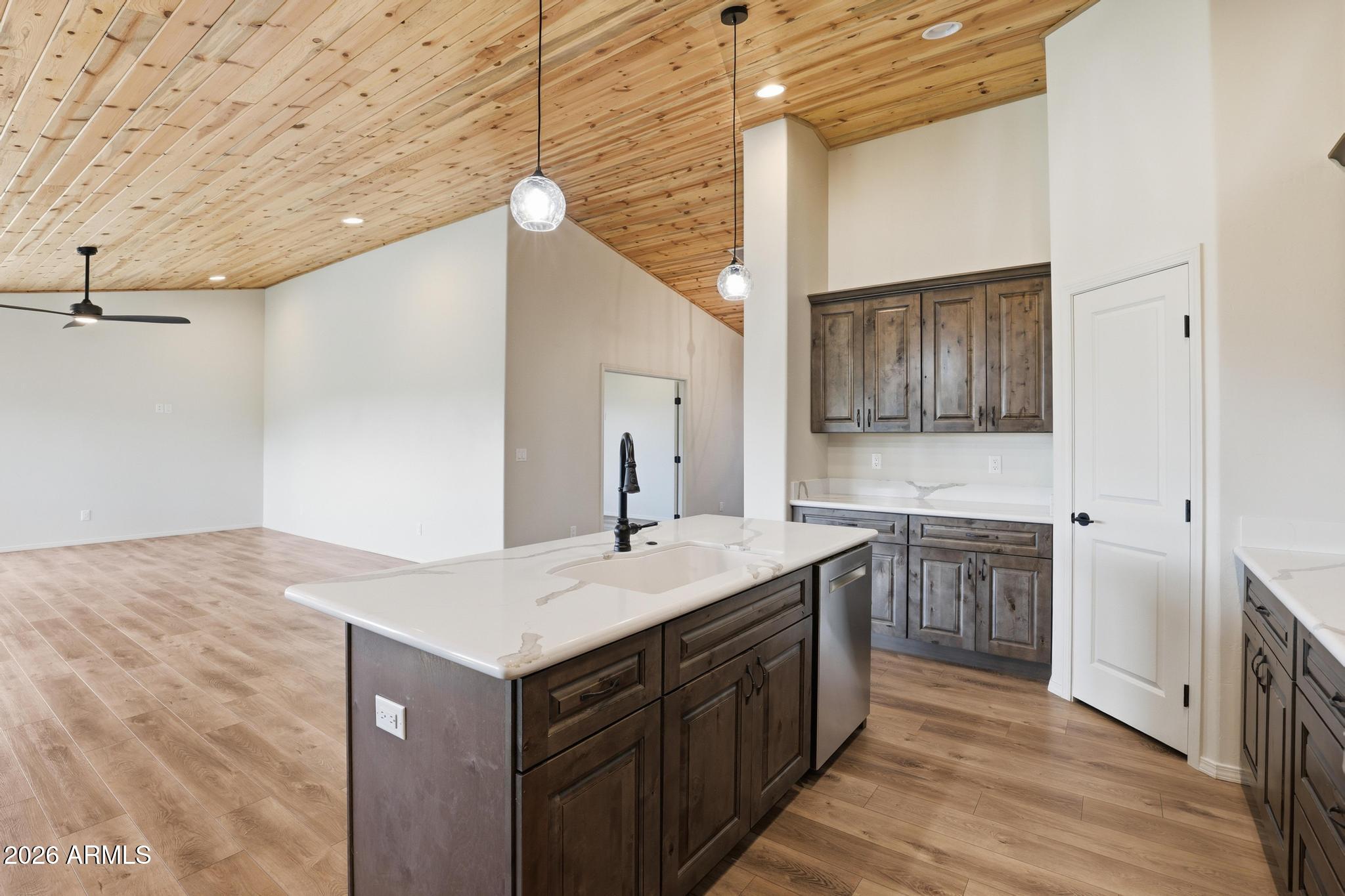 1908 East Starlight Pass Payson, AZ 85541 - Photo 21 of 30 a kitchen with a sink cabinets and wooden floor