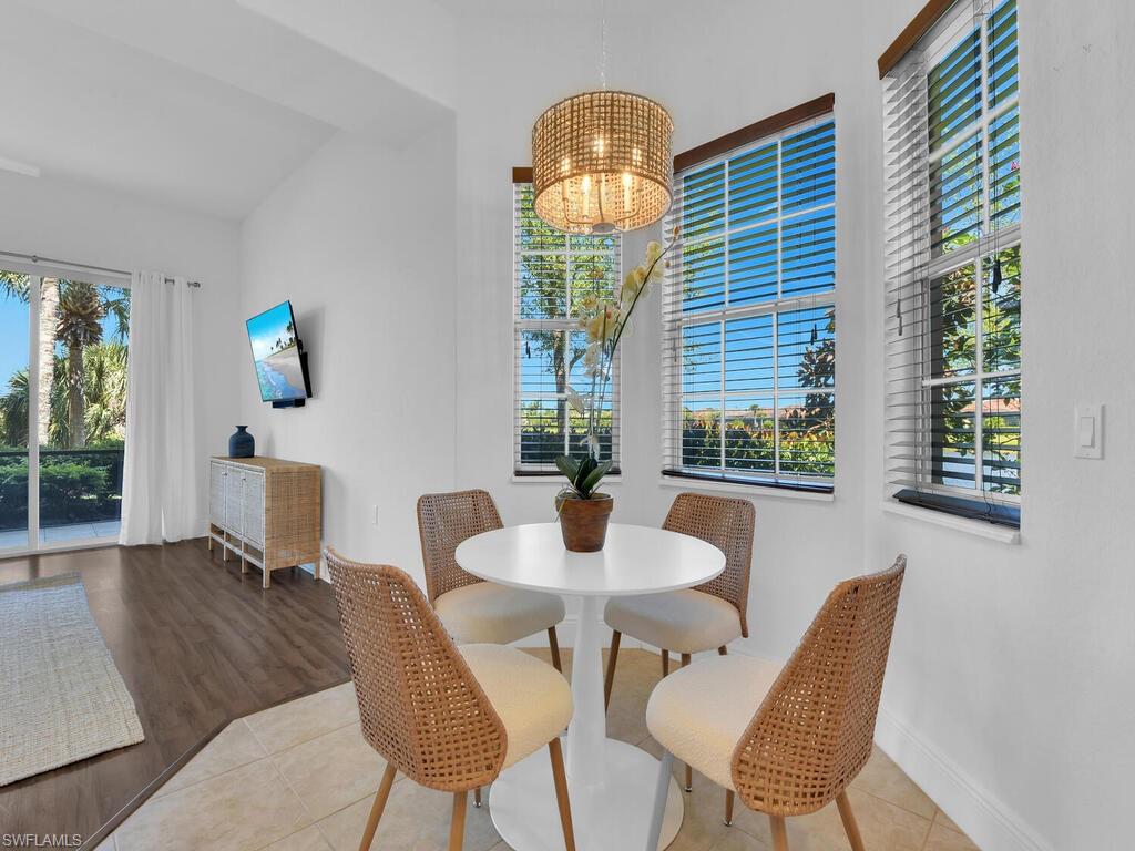 2710 Callista Court, Unit 104 Naples, FL 34114 - Photo 15 of 43 a dining room with furniture and window