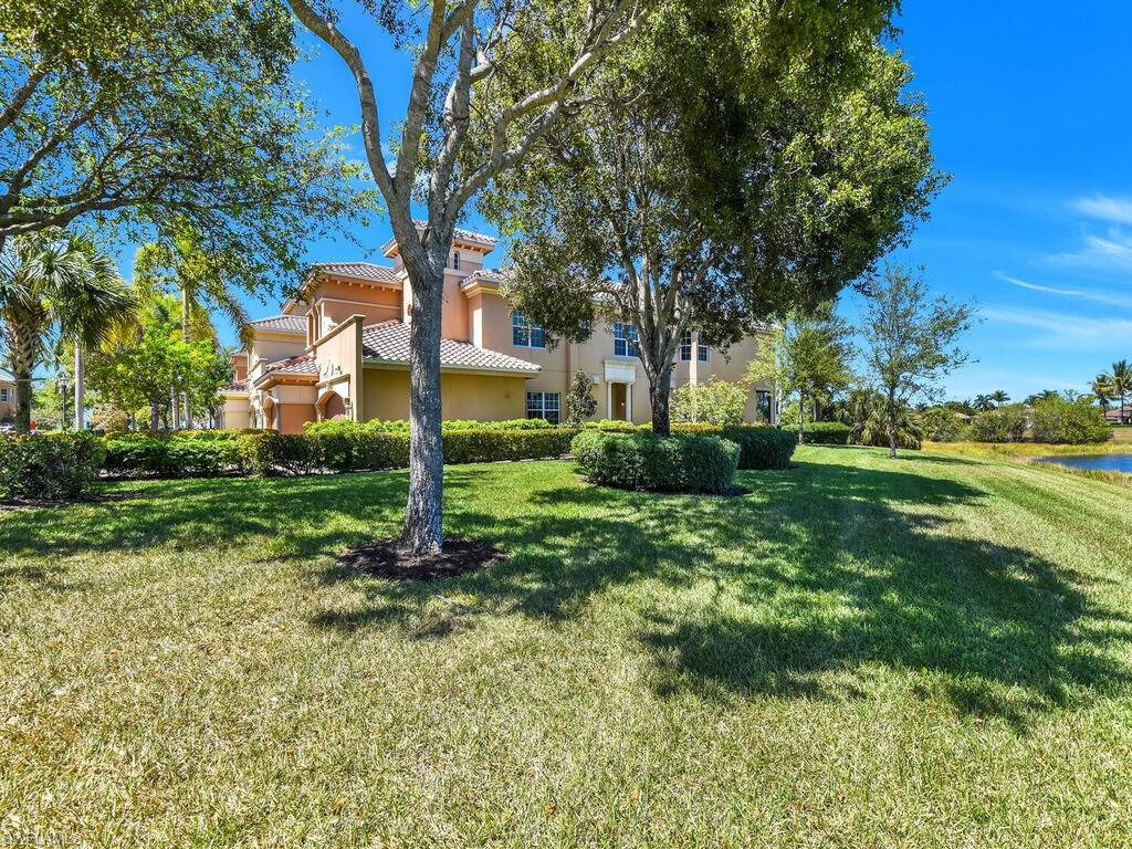 2710 Callista Court, Unit 104 Naples, FL 34114 - Photo 34 of 43 a backyard of a house with lots of green space