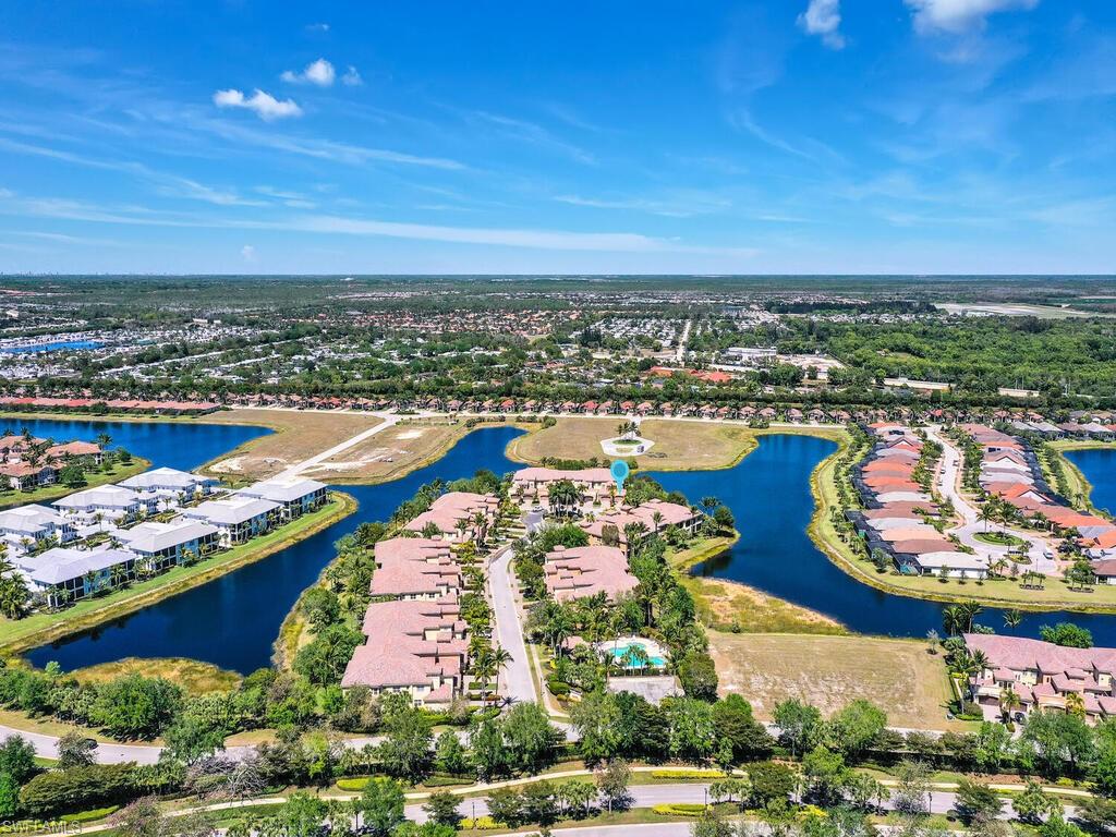 2710 Callista Court, Unit 104 Naples, FL 34114 - Photo 38 of 43 a city view with tall buildings