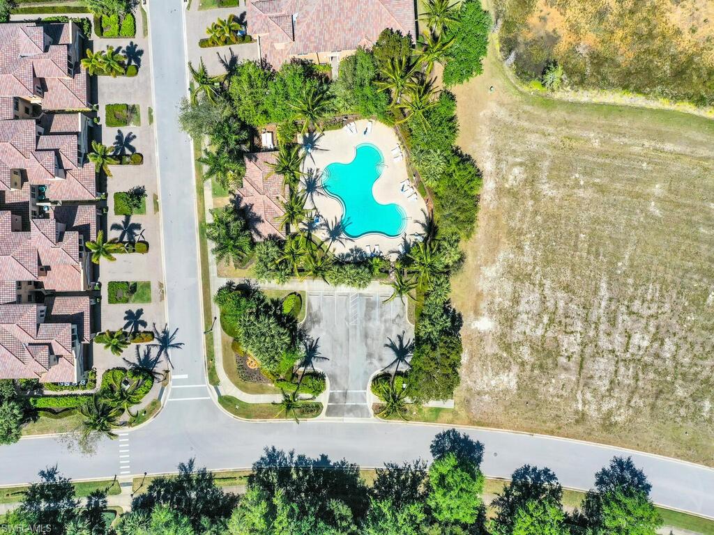 2710 Callista Court, Unit 104 Naples, FL 34114 - Photo 42 of 43 an aerial view of a residential houses with yard