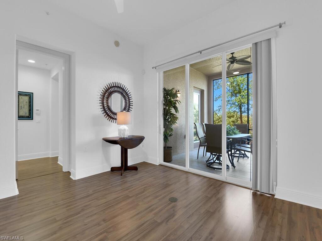 2710 Callista Court, Unit 104 Naples, FL 34114 - Photo 9 of 43 a living room with furniture and a potted plant