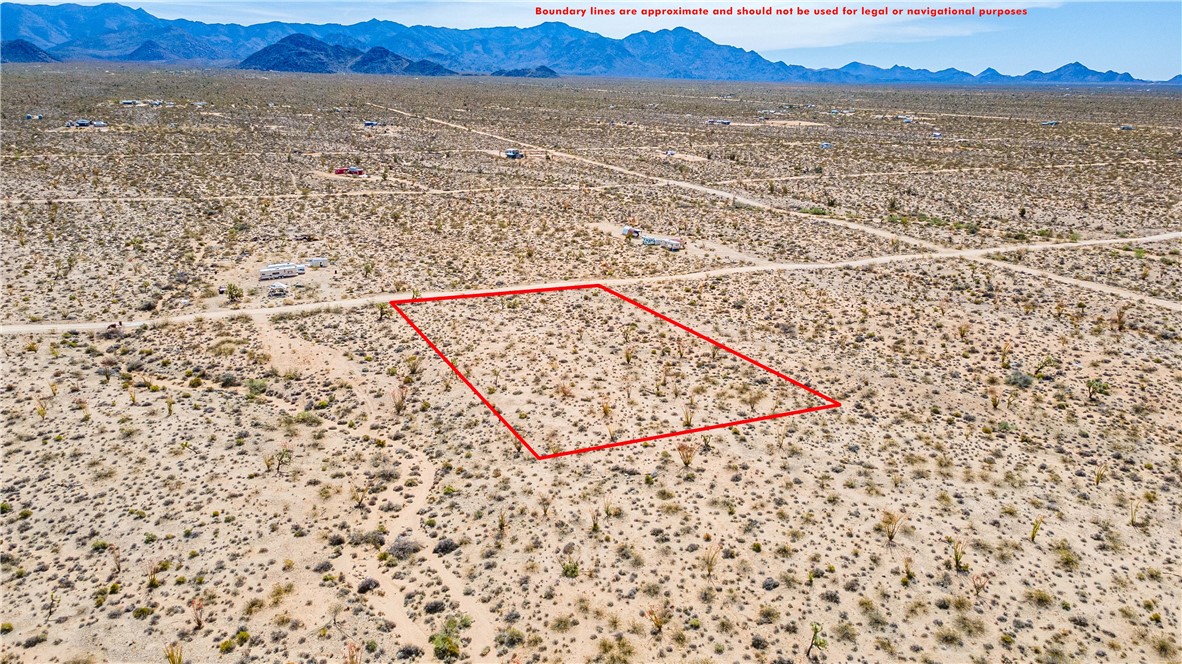 Lot 7 South Sherry Road Yucca, AZ 86438 - Photo 5 of 20 Overview of rural landscape with property boundaries highlighted, a mountain backdrop, and a desert landscape