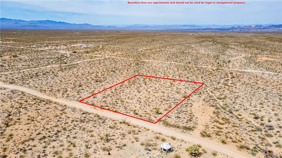 Lot 7 South Sherry Road Yucca, AZ 86438 - Photo 7 of 20 View of rural area with a desert landscape, a mountain backdrop, and property boundaries highlighted
