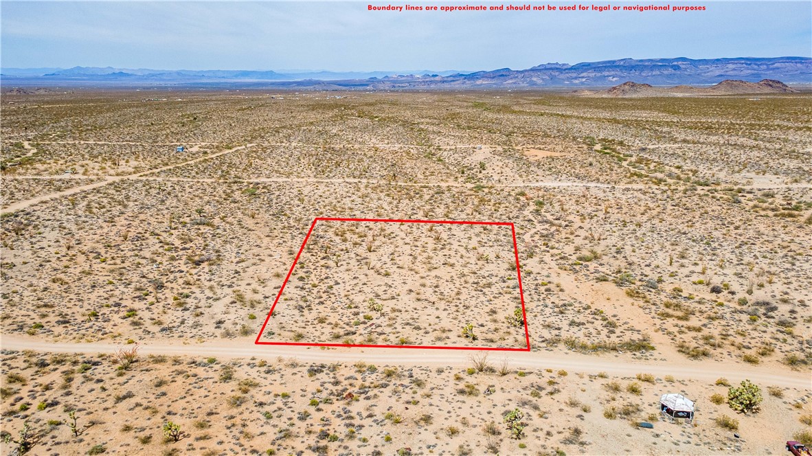 Lot 7 South Sherry Road Yucca, AZ 86438 - Photo 9 of 20 View of rural area featuring a desert landscape, property parcel outlined, and a mountainous background