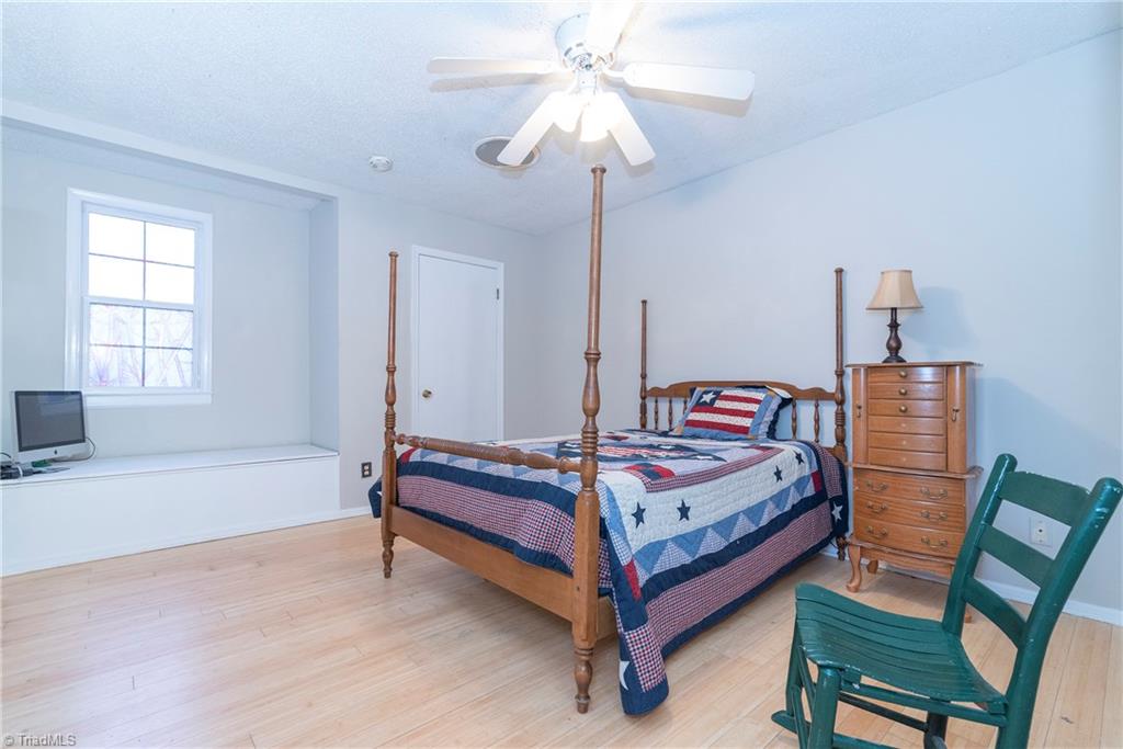 5771 Styers Ferry Road Clemmons, NC 27012 - Photo 15 of 19 Bedroom Three with built-in bench beneath window