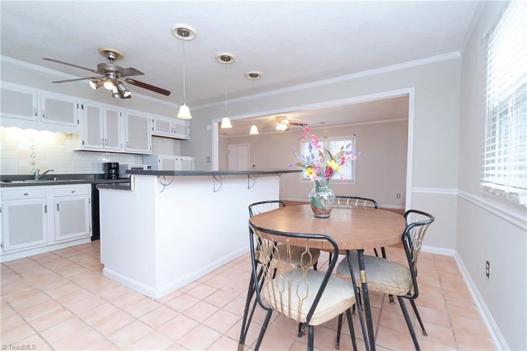5771 Styers Ferry Road Clemmons, NC 27012 - Photo 8 of 19 Kitchen/Dining from Pantry/Mudroom w/ laundry room off of it.