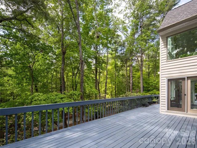 a view of a balcony with wooden floor
