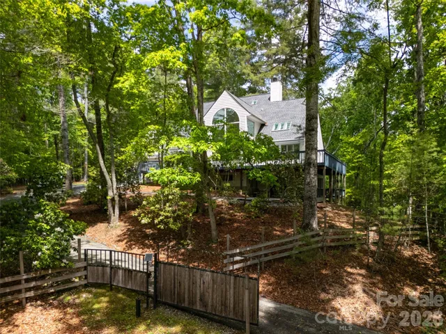 a house view with a tree in front of it