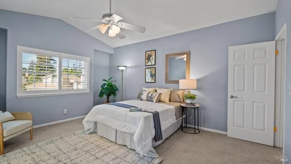 a bedroom with bed and window