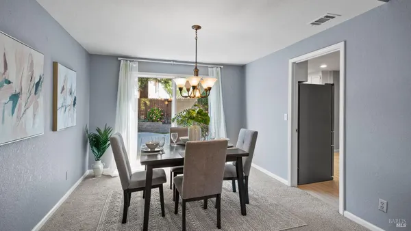 a view of a dining room with furniture window and outside view