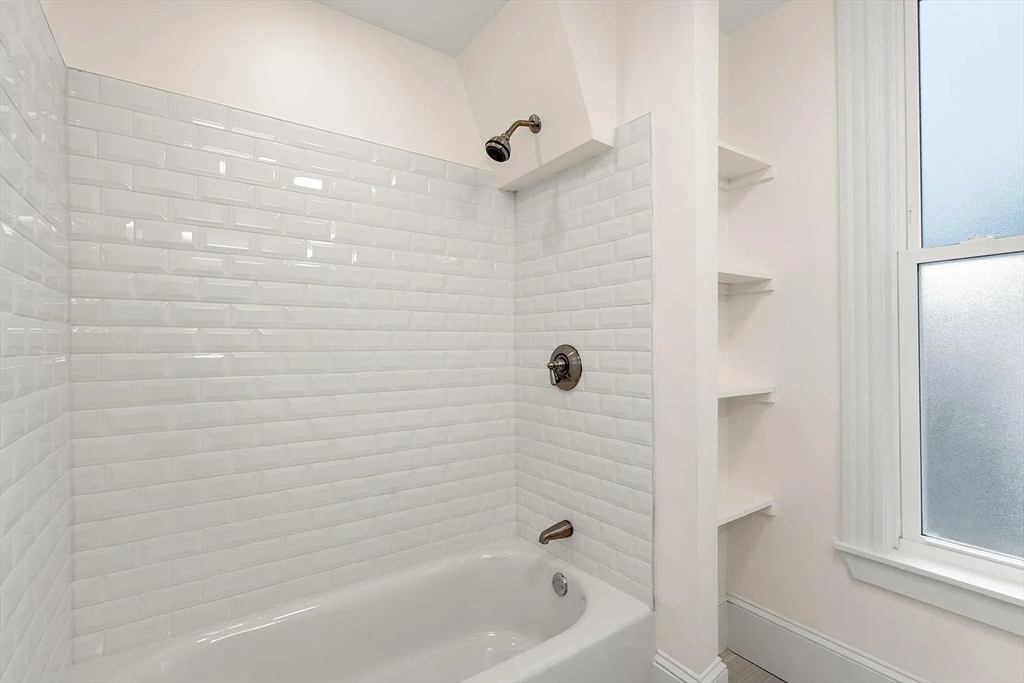 10 King Street, Unit 2 Boston, MA 02122 - Photo 11 of 17 a bathroom with a bathtub