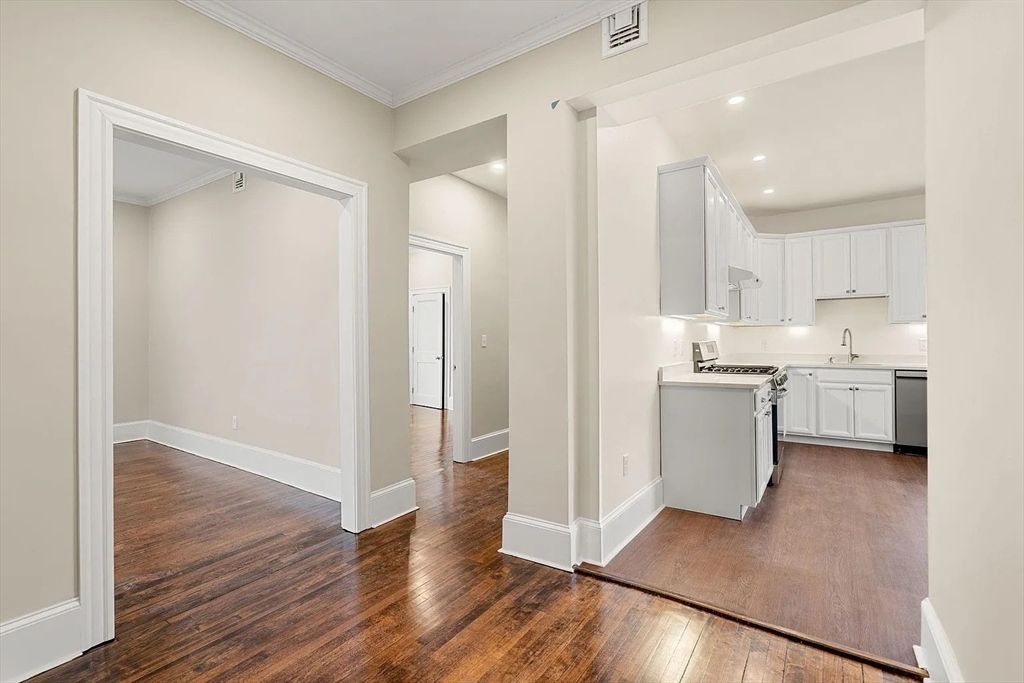 10 King Street, Unit 2 Boston, MA 02122 - Photo 3 of 17 a view of a kitchen with wooden floor