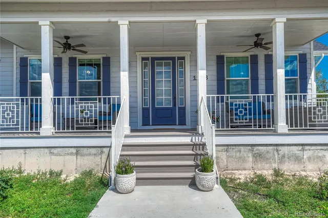 front view of a house with a potted plant