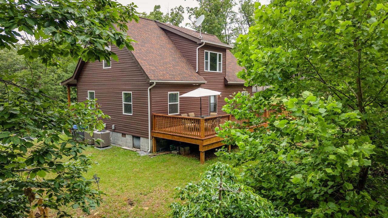 159 Park View Shenandoah, VA 22849 - Photo 57 of 70 a backyard of a house with a garden and deck