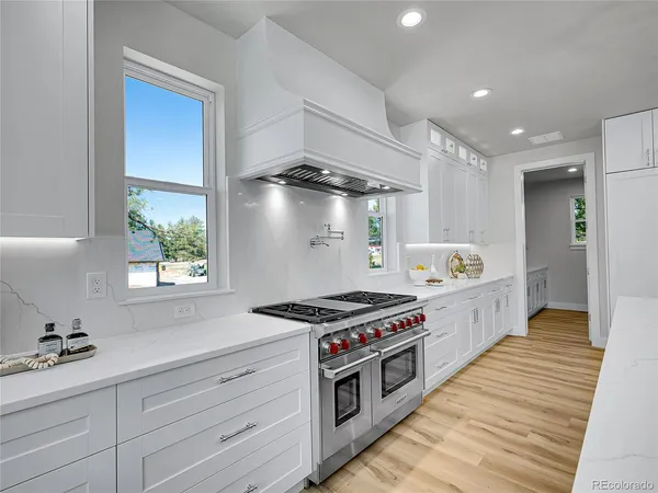 a kitchen with stainless steel appliances a stove and a refrigerator