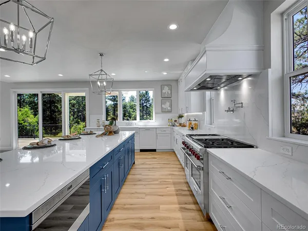a large kitchen with granite countertop lots of counter space and window