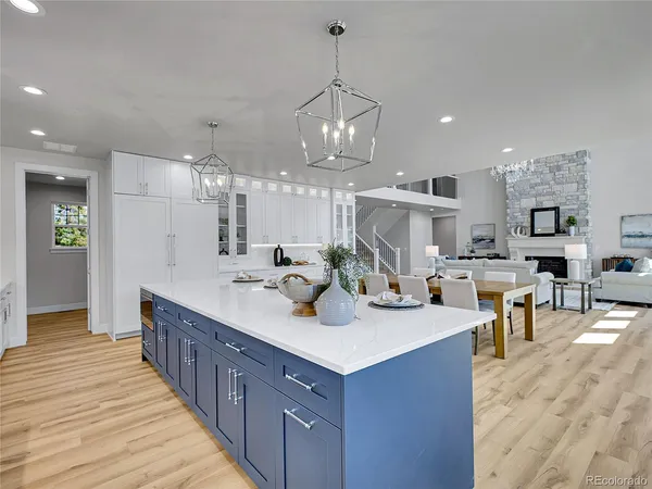 a kitchen with sink and cabinets