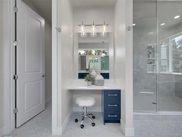 a view of a bathroom with a sink and mirror
