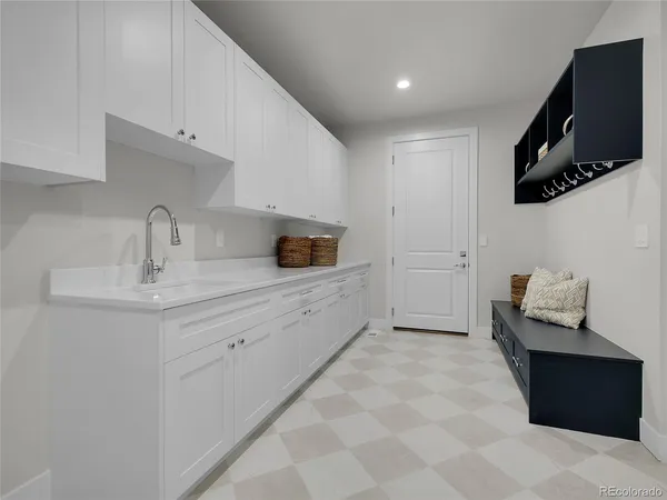 a spacious bathroom with a sink a mirror and bathtub