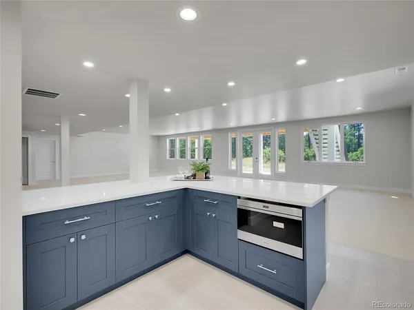 a kitchen with white cabinets