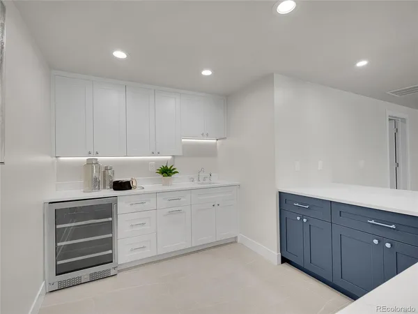 a bathroom with a sink a large mirror and shower