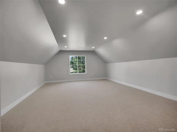 a bathroom with double vanity sinks and a mirror