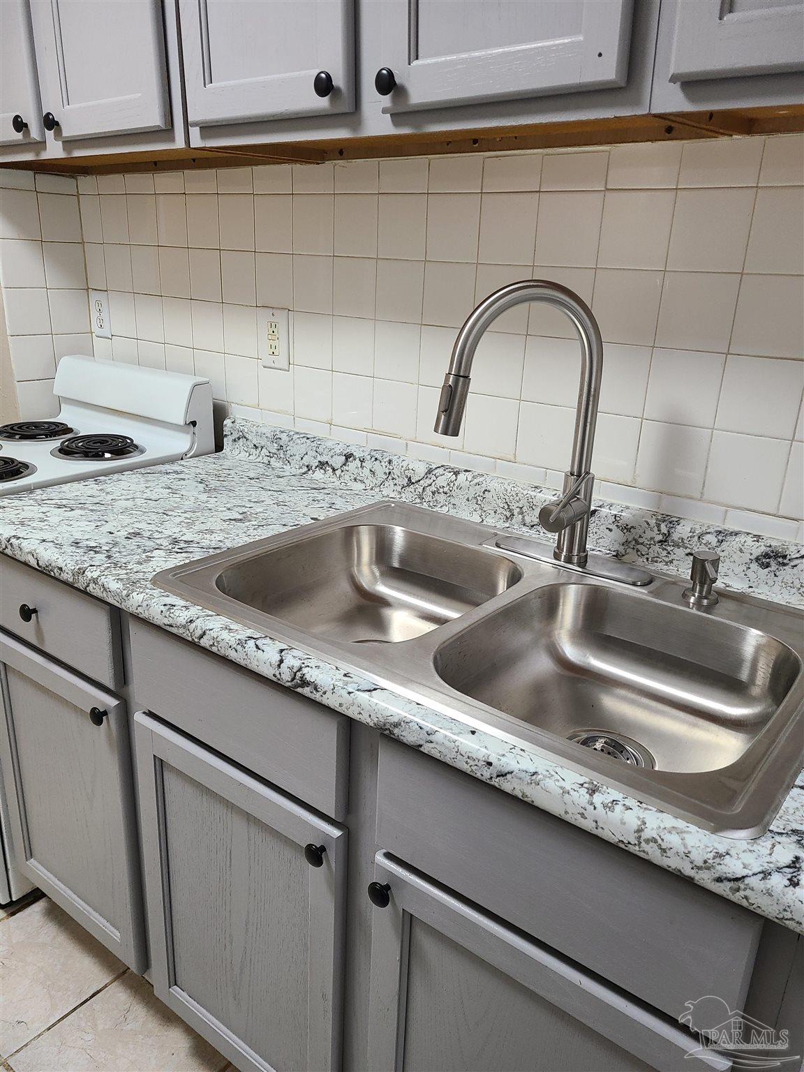 612 McCarroll Road, Unit B Pensacola, FL 32507 - Photo 6 of 13 a close view of sink and tap