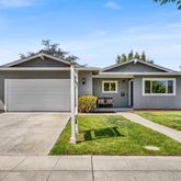 a front view of a house with yard