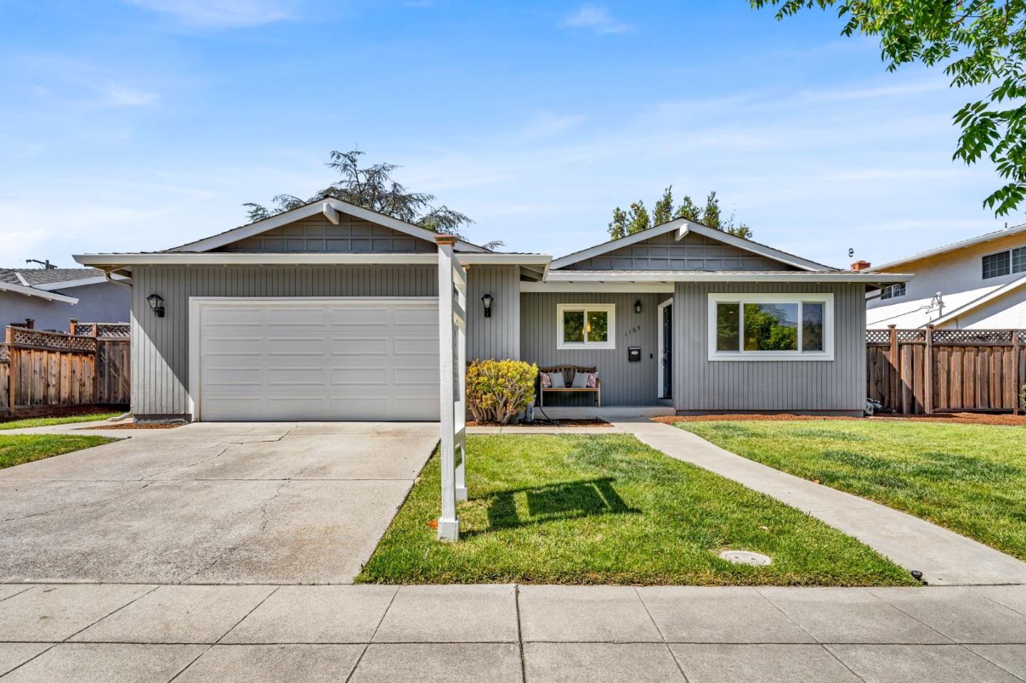 a front view of a house with yard
