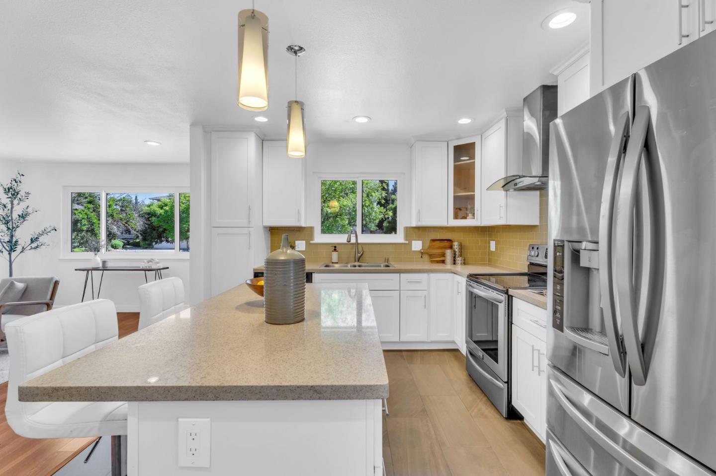 1165 Nadine Drive Campbell, CA 95008 - Photo 11 of 66 a kitchen with stainless steel appliances granite countertop a sink refrigerator and stove