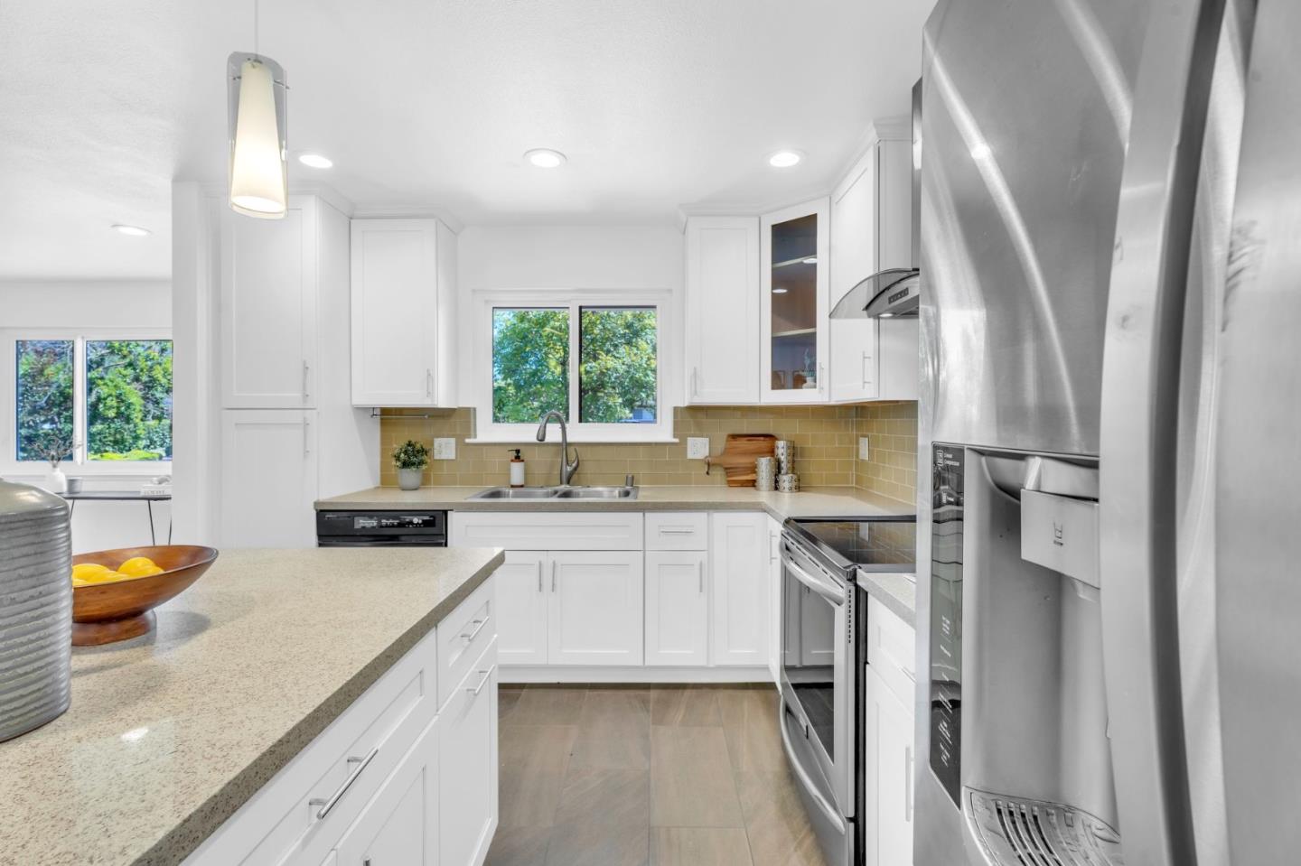 1165 Nadine Drive Campbell, CA 95008 - Photo 12 of 66 a kitchen with stainless steel appliances granite countertop a stove a sink and a refrigerator