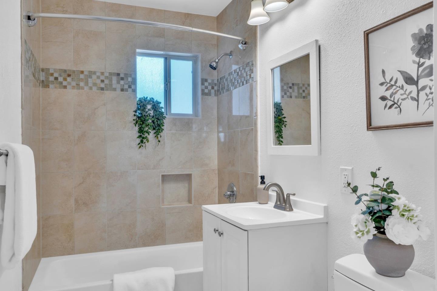 1165 Nadine Drive Campbell, CA 95008 - Photo 21 of 66 a bathroom with a sink a toilet and a mirror