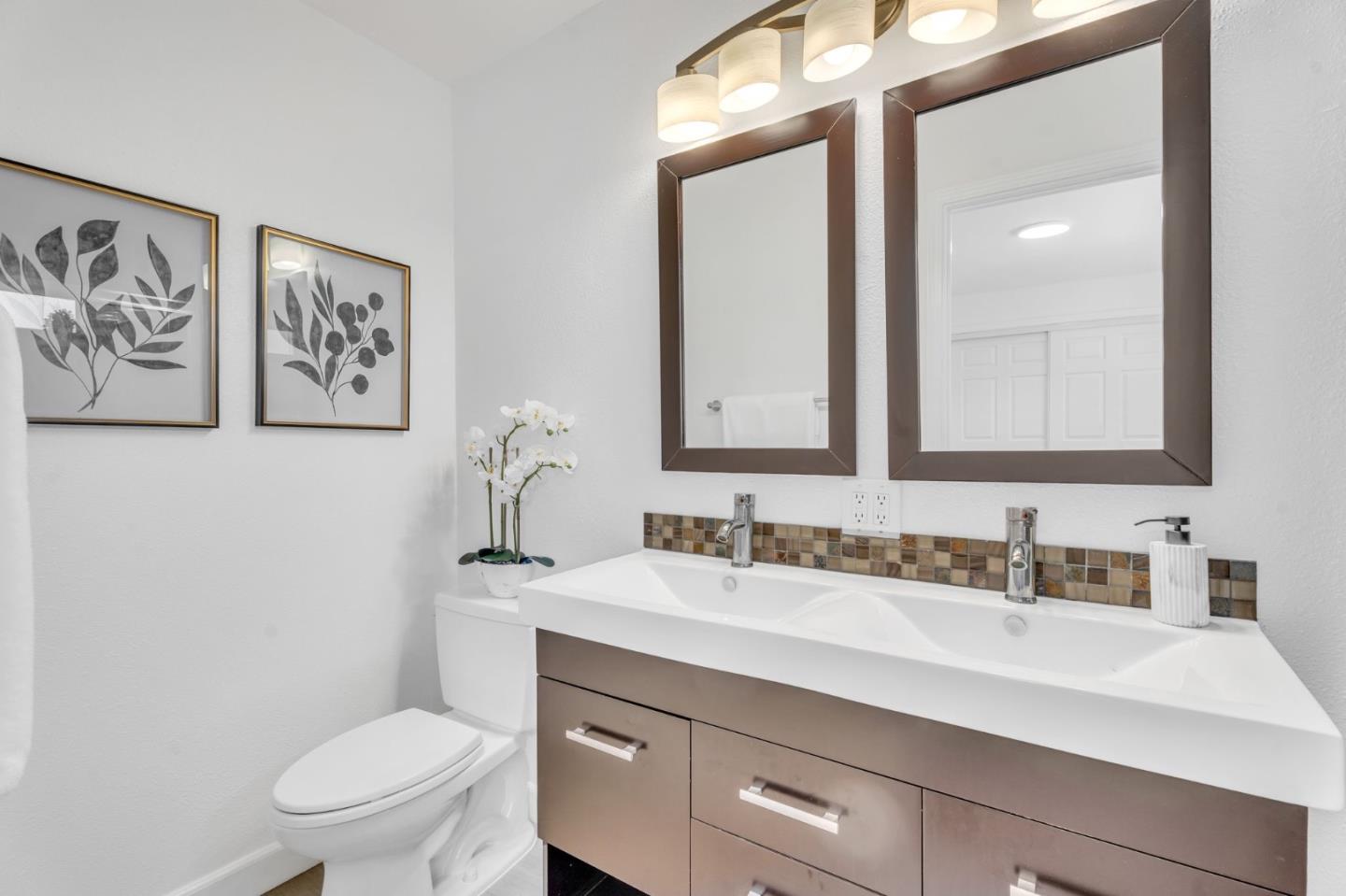 1165 Nadine Drive Campbell, CA 95008 - Photo 32 of 66 a bathroom with a toilet sink and mirror