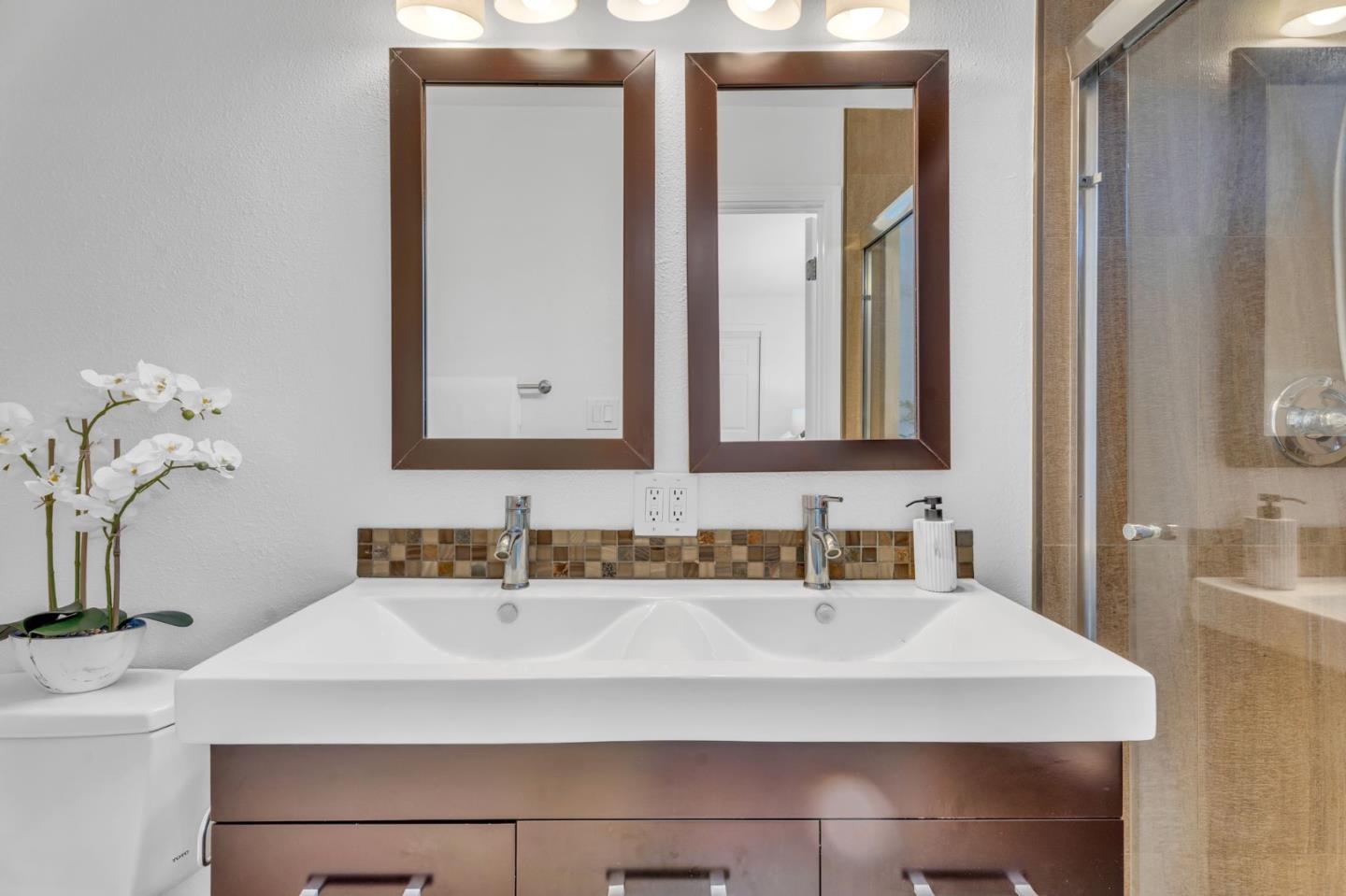 1165 Nadine Drive Campbell, CA 95008 - Photo 33 of 66 a bathroom with a sink and a mirror