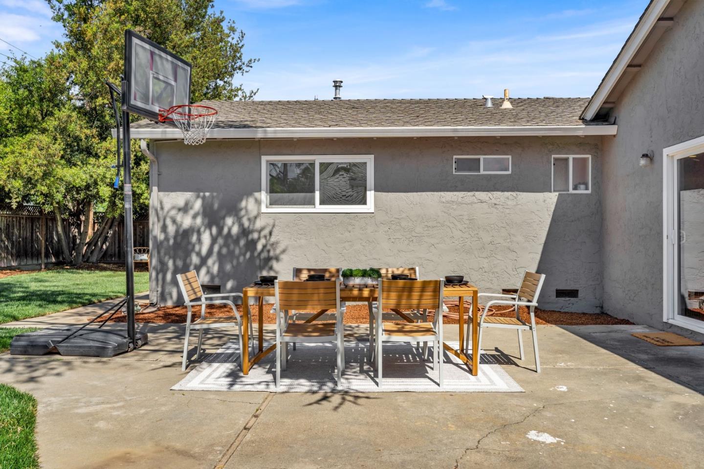 1165 Nadine Drive Campbell, CA 95008 - Photo 39 of 66 a view of a patio with table and chairs with wooden fence and plants