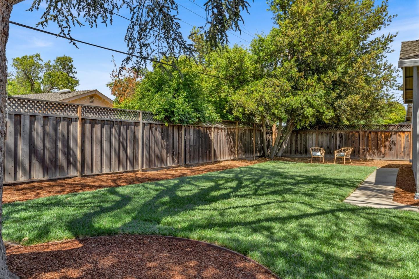 1165 Nadine Drive Campbell, CA 95008 - Photo 40 of 66 a backyard of a house with table and chairs